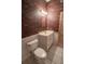 Clean bathroom with brick walls and white toilet at 3598 Brock Rd, Duluth, GA 30096