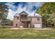 Brick house with two-story deck and attached garage at 3598 Brock Rd, Duluth, GA 30096