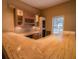 L-shaped bar with wood cabinets and tile backsplash at 3598 Brock Rd, Duluth, GA 30096