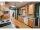 Kitchen with light wood cabinets, double sink, and hardwood floors at 3598 Brock Rd, Duluth, GA 30096