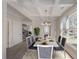 Bright dining room featuring a spacious table, hardwood floors, and a coffered ceiling at 661 Hugh Sw St, Atlanta, GA 30310