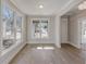 Bright dining room with hardwood floors and large windows overlooking street at 661 Hugh Sw St, Atlanta, GA 30310