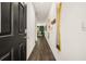 Modern entryway with dark hardwood floors and mirrors at 2718 Honey Locust Ct, Loganville, GA 30052