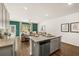 Spacious kitchen island open to living area with hardwood floors at 2718 Honey Locust Ct, Loganville, GA 30052