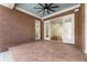 Brick covered patio with tile flooring, ceiling fan, and access to deck at 6202 Talmadge Nw Way, Acworth, GA 30101