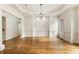 Spacious formal dining room with hardwood floors, wainscoting, and chandelier at 6202 Talmadge Nw Way, Acworth, GA 30101