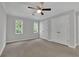 Spacious bedroom with neutral walls, carpeting, and ample closet space at 10 Braemore Dr, Sandy Springs, GA 30328