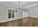 Bright dining room with hardwood floors, large windows, and access to a patio at 10 Braemore Dr, Sandy Springs, GA 30328