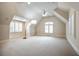 Spacious bonus room with vaulted ceiling, carpet, and multiple windows at 85 Beverly Ne Rd, Atlanta, GA 30309