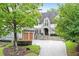 Two-story home with stone accents and a three-car garage at 85 Beverly Ne Rd, Atlanta, GA 30309