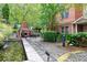 Relaxing courtyard with a water feature and brick fireplace at 3621 Vinings Slope Se # 1537, Atlanta, GA 30339