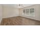 Living room with wood-look flooring and large windows at 1883 Cindy Dr, Decatur, GA 30032