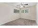 Bedroom with ceiling fan, neutral walls, and carpet flooring at 1883 Cindy Dr, Decatur, GA 30032
