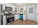 Bright kitchen with white cabinets, stainless steel appliances, and blue dishwasher at 1883 Cindy Dr, Decatur, GA 30032