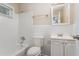 Updated bathroom with white tile, vanity, and bathtub at 1883 Cindy Dr, Decatur, GA 30032