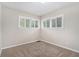 Spacious bedroom featuring neutral walls, carpet flooring, and large windows at 1883 Cindy Dr, Decatur, GA 30032