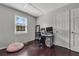 Well-lit bedroom with dark hardwood floors and ample closet space at 2320 Boone Pl, Snellville, GA 30078