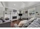 Living room with hardwood floors, fireplace, and a TV at 2320 Boone Pl, Snellville, GA 30078