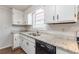 Kitchen with white cabinets, granite countertops, and black dishwasher at 6275 S Skyline Dr, Douglasville, GA 30135