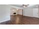 Spacious living room featuring hardwood floors, a fireplace, and ceiling fan at 6275 S Skyline Dr, Douglasville, GA 30135