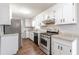 Bright kitchen featuring stainless steel appliances and granite countertops at 6275 S Skyline Dr, Douglasville, GA 30135