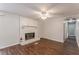 Living room with fireplace, hardwood floors, and access to hallway at 6275 S Skyline Dr, Douglasville, GA 30135
