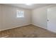 Simple bedroom with carpet flooring and a window at 6275 S Skyline Dr, Douglasville, GA 30135