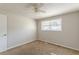 Spacious bedroom with neutral walls, carpet, and ceiling fan at 6275 S Skyline Dr, Douglasville, GA 30135