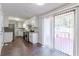Eat-in kitchen with stainless steel appliances and access to deck at 6275 S Skyline Dr, Douglasville, GA 30135