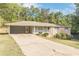 Ranch style home with carport and mature landscaping at 6275 S Skyline Dr, Douglasville, GA 30135