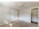 Bright bedroom with neutral walls, carpet, and ceiling fan at 6275 S Skyline Dr, Douglasville, GA 30135