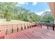 Spacious deck with built-in benches overlooking a wooded area at 6275 S Skyline Dr, Douglasville, GA 30135