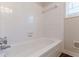 Simple bathroom with a bathtub and white tile at 6275 S Skyline Dr, Douglasville, GA 30135