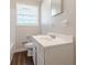 Bright bathroom with a vanity, toilet, and bathtub at 6275 S Skyline Dr, Douglasville, GA 30135
