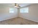 Spacious bedroom with ceiling fan and large windows at 6275 S Skyline Dr, Douglasville, GA 30135