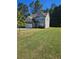 Two-story house with gray siding and a two car garage at 958 Fellowship Rd, Fairburn, GA 30213