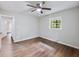 Bright bedroom with ceiling fan and hardwood-style flooring at 3599 Dial Dr, Stone Mountain, GA 30083