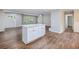 Modern kitchen island with white cabinets and quartz countertop at 3599 Dial Dr, Stone Mountain, GA 30083