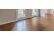 Dark hardwood floors in a sunlit living area at 4348 Meadow Vista Dr, Stonecrest, GA 30038