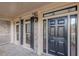 Black front door with glass panels and sidelights at 4348 Meadow Vista Dr, Stonecrest, GA 30038