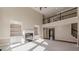 Two-story great room with fireplace and built-in shelving at 4348 Meadow Vista Dr, Stonecrest, GA 30038