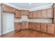 Kitchen with wood cabinets, granite countertops, and hardwood floors at 4348 Meadow Vista Dr, Stonecrest, GA 30038