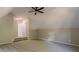 Bonus room with carpet, ceiling fan and access to hallway at 4348 Meadow Vista Dr, Stonecrest, GA 30038