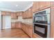 Kitchen with double oven and granite countertops at 4348 Meadow Vista Dr, Stonecrest, GA 30038