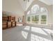 Spacious great room with wall of windows and vaulted ceiling at 4348 Meadow Vista Dr, Stonecrest, GA 30038