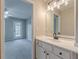 Bright bathroom with white vanity and access to bedroom at 4348 Meadow Vista Dr, Stonecrest, GA 30038