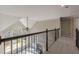 Open upper hallway overlooking living room with iron railing at 4348 Meadow Vista Dr, Stonecrest, GA 30038