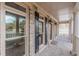 Brick porch with columns, black shutters, and a covered entryway at 4348 Meadow Vista Dr, Stonecrest, GA 30038