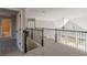 Open upper hallway with access to bathroom and view of living area at 4348 Meadow Vista Dr, Stonecrest, GA 30038