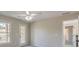 Bedroom with private balcony access and ceiling fan at 4348 Meadow Vista Dr, Stonecrest, GA 30038